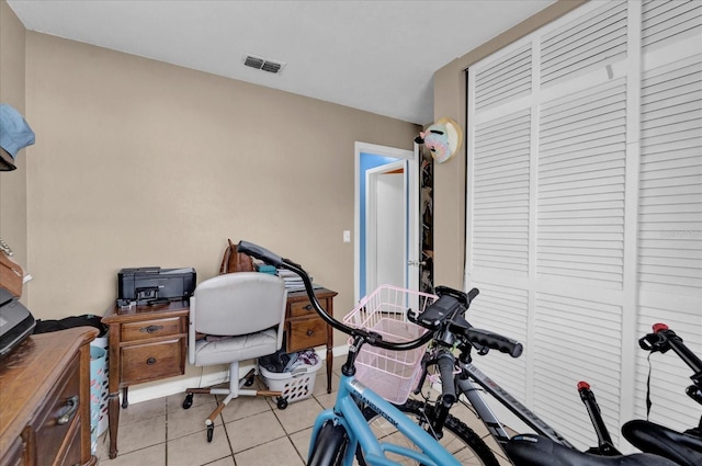 home office featuring visible vents and light tile patterned floors