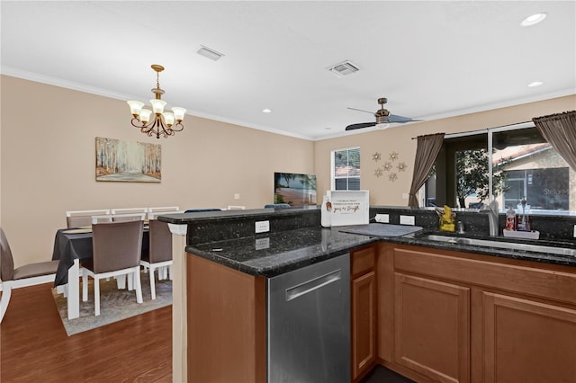 kitchen featuring dishwasher, ornamental molding, dark wood finished floors, and visible vents