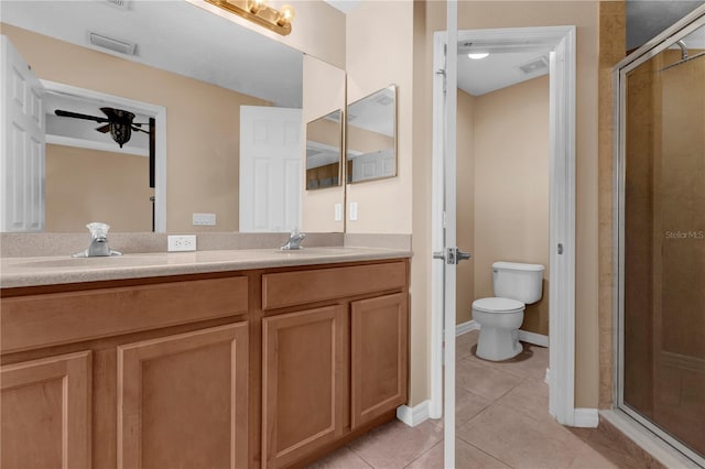 full bath with double vanity, visible vents, a sink, and tile patterned floors