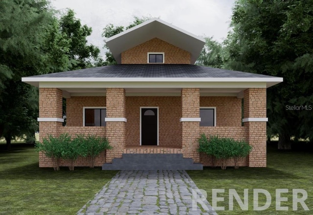 view of front facade featuring brick siding and a front yard