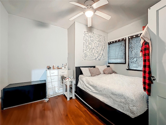 bedroom with a ceiling fan and wood finished floors
