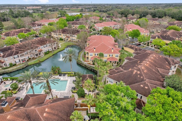 bird's eye view featuring a water view and a residential view