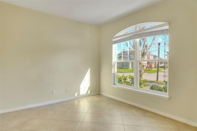 tiled empty room with baseboards