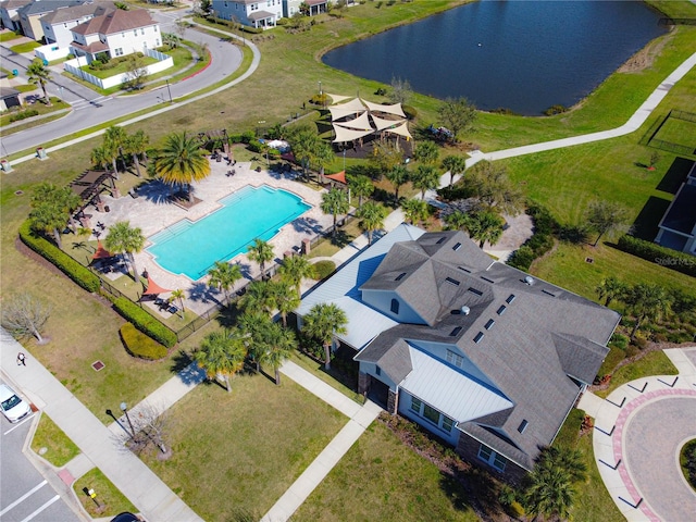 drone / aerial view with a water view and a residential view