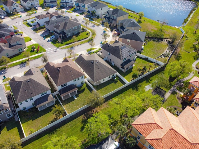 bird's eye view with a water view and a residential view