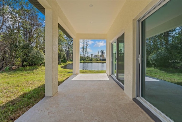 view of patio featuring a water view