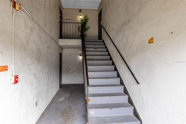 stairway with concrete floors