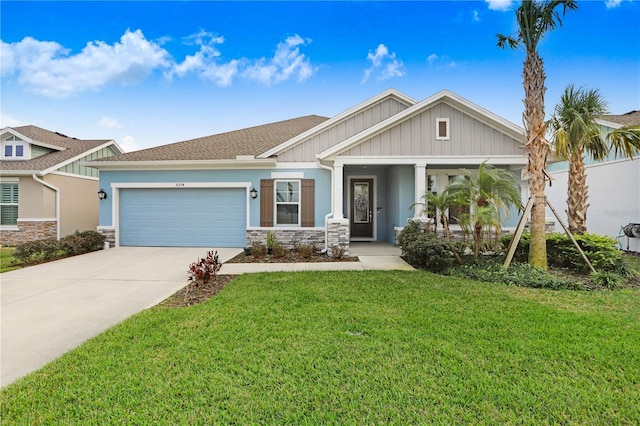 view of front of property featuring a garage, stone siding, driveway, and a front lawn