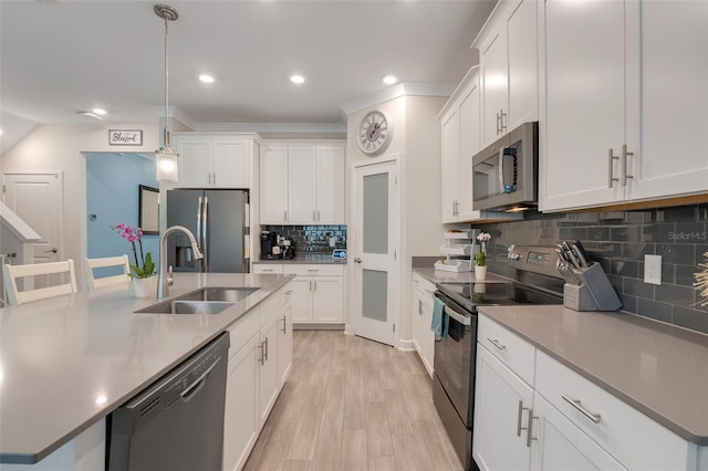 1472 Rushing Rapids Way, Winter Springs, FL 32708 - kitchen featuring stainless steel appliances, tasteful backsplash, white cabinets, light wood-type flooring, and recessed lighting