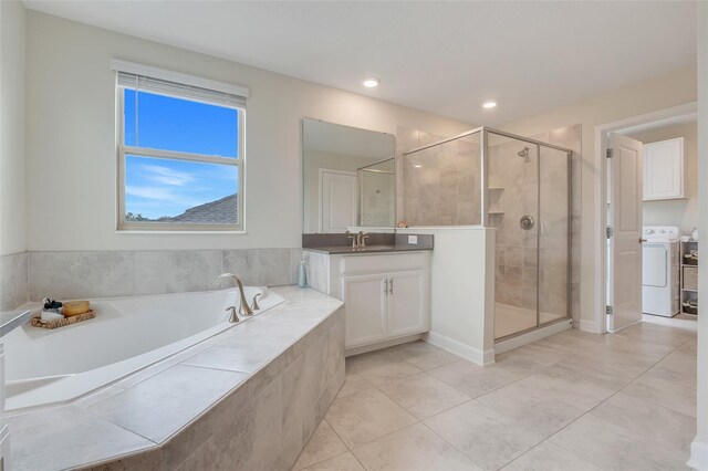 1472 Rushing Rapids Way, Winter Springs, FL 32708 - bathroom featuring vanity, a bath, a stall shower, tile patterned floors, and independent washer and dryer