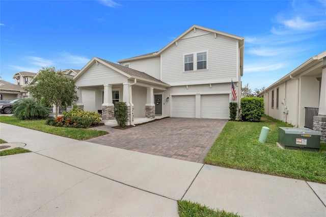 1472 Rushing Rapids Way, Winter Springs, FL 32708 - view of front facade featuring a garage, decorative driveway, covered porch, a front yard, and stucco siding