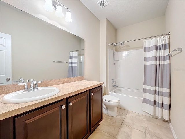 full bath featuring toilet, vanity, visible vents, tile patterned floors, and shower / bath combo