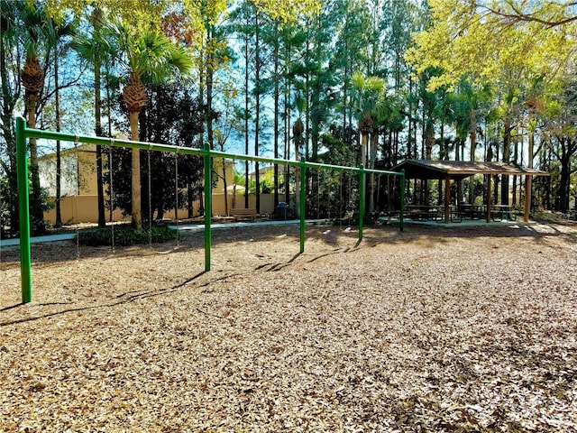 view of property's community featuring playground community and a gazebo