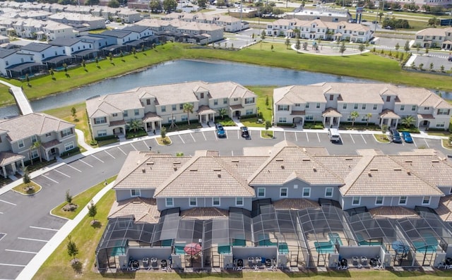 bird's eye view featuring a residential view and a water view