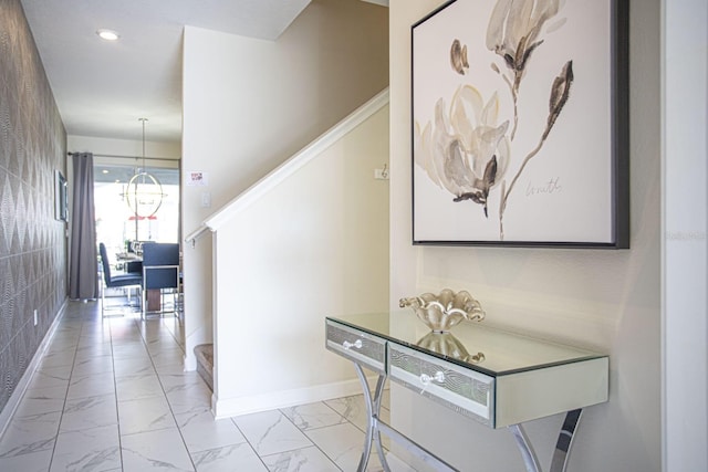 hallway featuring stairs, marble finish floor, recessed lighting, and baseboards