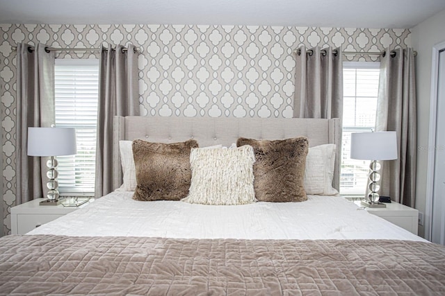 bedroom with wallpapered walls