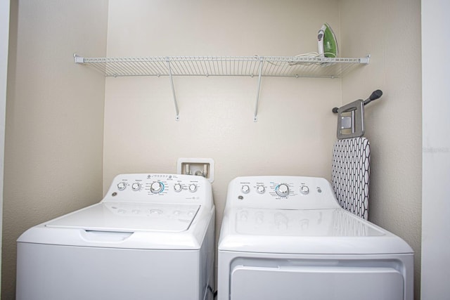laundry room with laundry area and separate washer and dryer