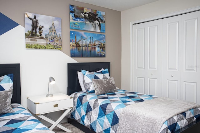 bedroom featuring a closet and carpet