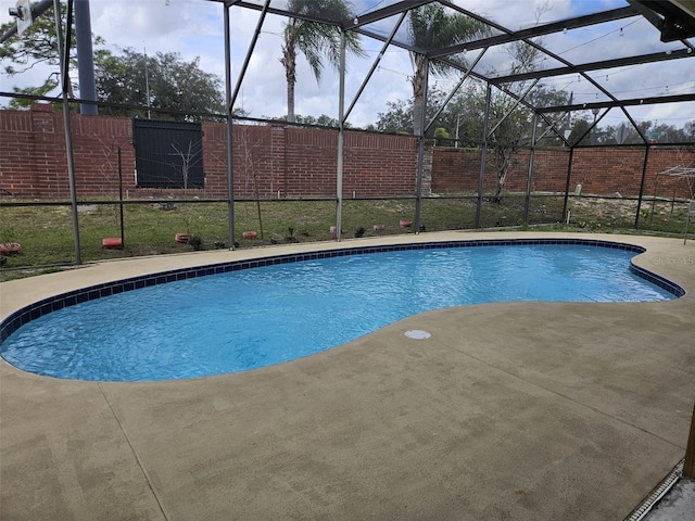 view of pool with a patio area, a lanai, and a fenced in pool