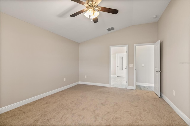 unfurnished bedroom featuring visible vents, carpet flooring, vaulted ceiling, ceiling fan, and baseboards