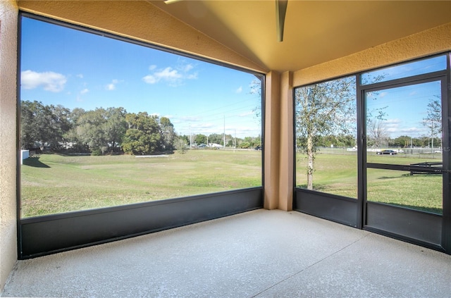 unfurnished sunroom with vaulted ceiling