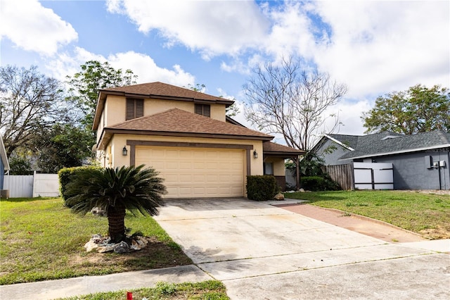 view of front of house featuring stucco siding, an attached garage, a front yard, fence, and driveway