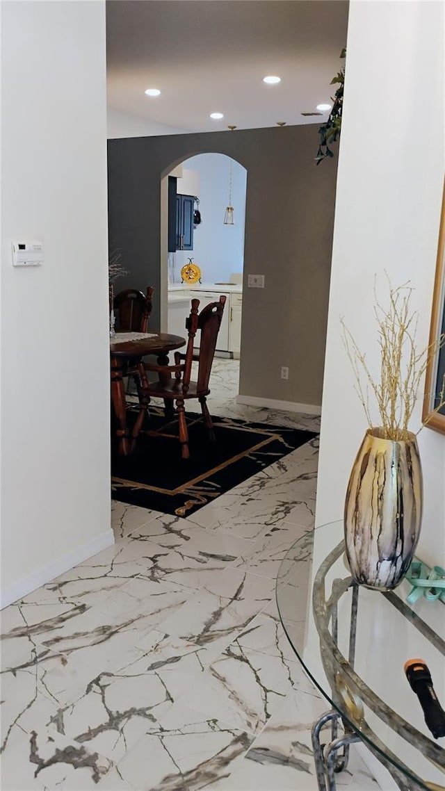 12209 Putter Green Ct, New Port Richey, FL 34654 - corridor featuring arched walkways, recessed lighting, baseboards, and light marble finish floors