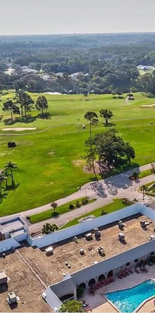 12209 Putter Green Ct, New Port Richey, FL 34654 - bird's eye view of a pool area and a golf club