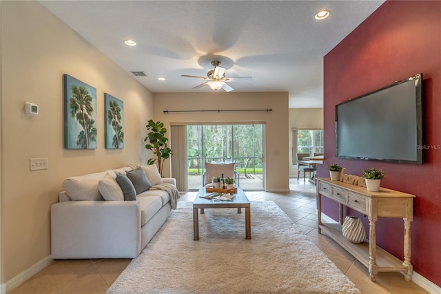 living area featuring recessed lighting, visible vents, baseboards, and light tile patterned floors