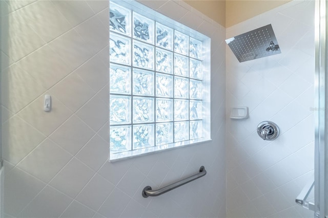 full bath featuring a tile shower