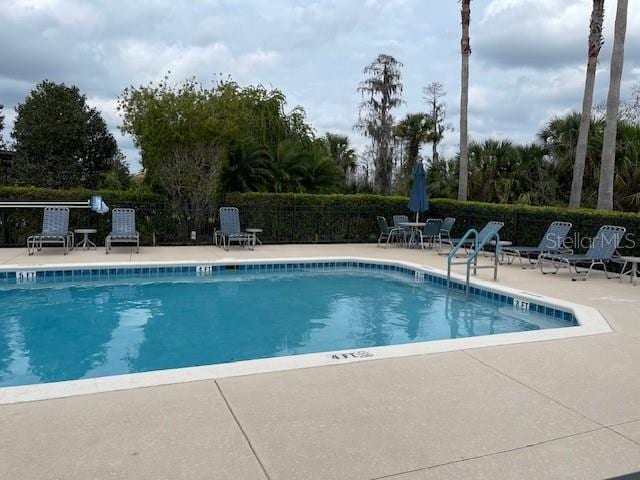 community pool with a patio