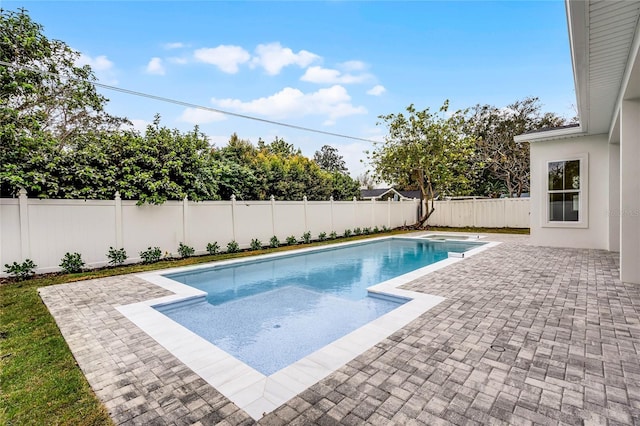 view of swimming pool with a patio area, a fenced backyard, and a fenced in pool