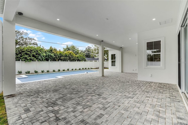 view of swimming pool with a patio area, a fenced backyard, and a fenced in pool