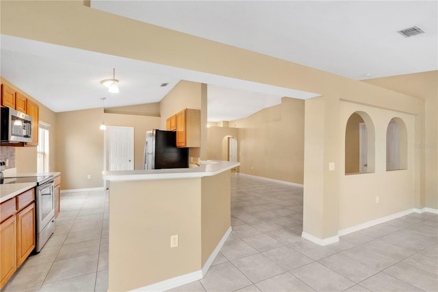 kitchen with lofted ceiling, light tile patterned flooring, visible vents, light countertops, and appliances with stainless steel finishes