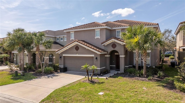 mediterranean / spanish home featuring a garage, concrete driveway, a tile roof, a front lawn, and stucco siding