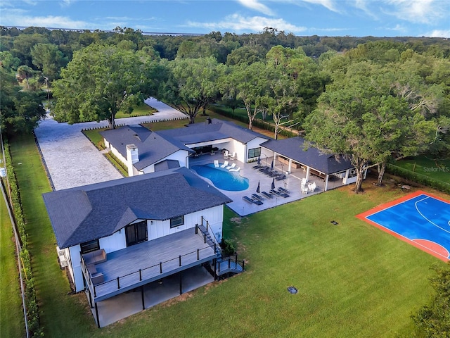 drone / aerial view featuring a view of trees