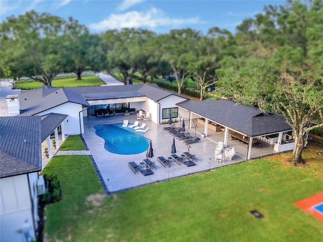 pool with a patio, a lawn, and a gazebo