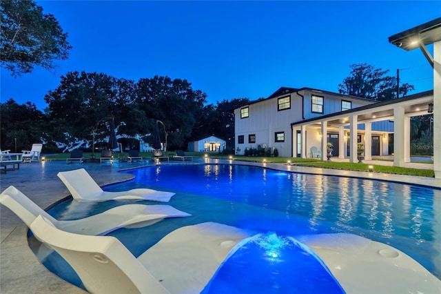 pool with a patio area