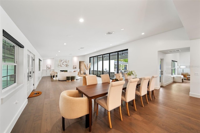 dining room featuring recessed lighting, visible vents, baseboards, and wood finished floors