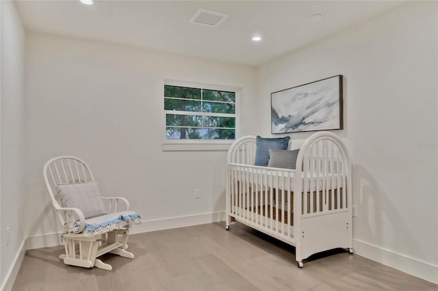 bedroom featuring recessed lighting, baseboards, and wood finished floors