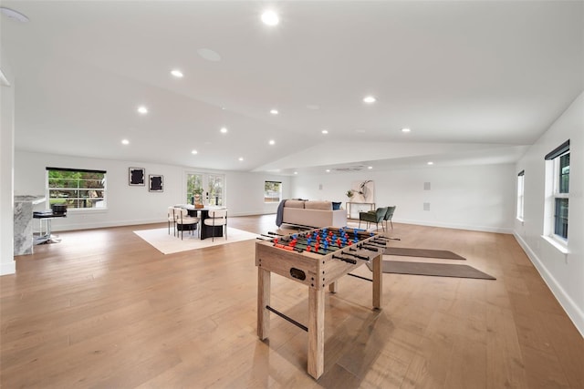 rec room with light wood-type flooring, baseboards, vaulted ceiling, and recessed lighting