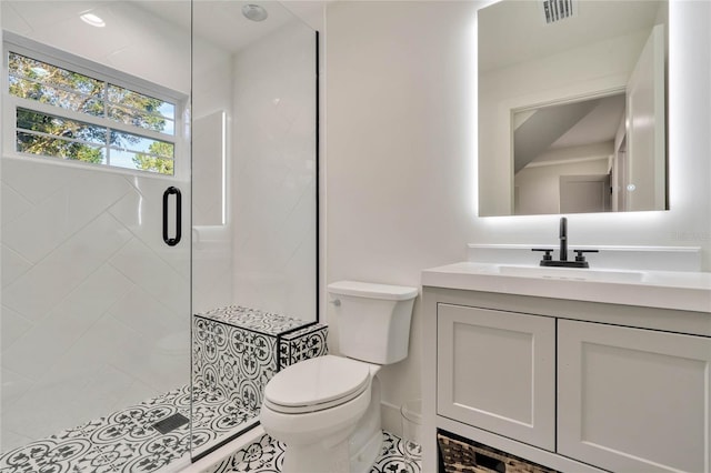 full bath with toilet, a shower stall, visible vents, and vanity