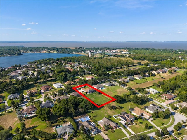 bird's eye view with a water view and a residential view