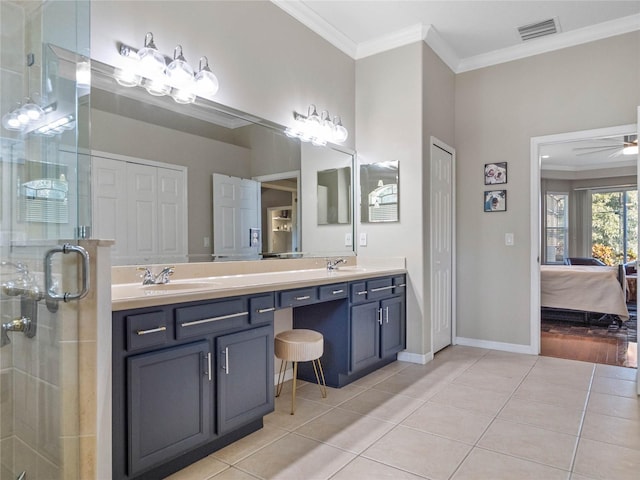 ensuite bathroom with ornamental molding, a closet, ensuite bath, and tile patterned floors