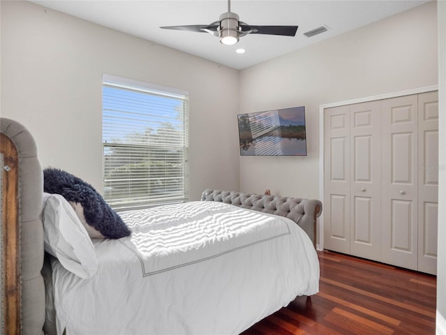 bedroom with visible vents, dark wood finished floors, ceiling fan, a closet, and recessed lighting