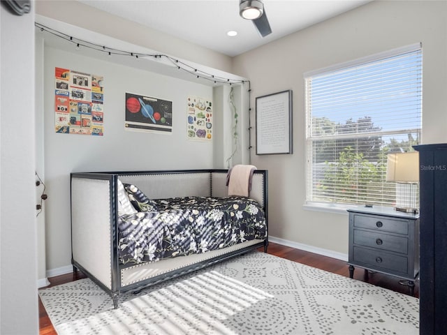 bedroom featuring ceiling fan, recessed lighting, wood finished floors, and baseboards