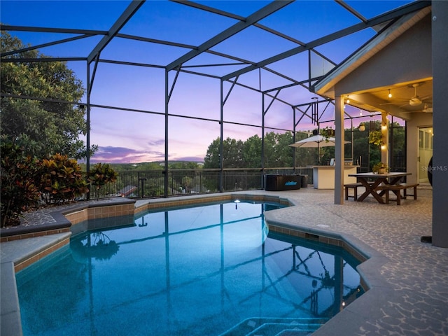 view of pool featuring a patio, a lanai, fence, a ceiling fan, and a fenced in pool