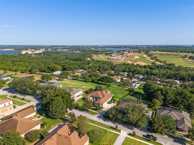 drone / aerial view with a water view and a residential view