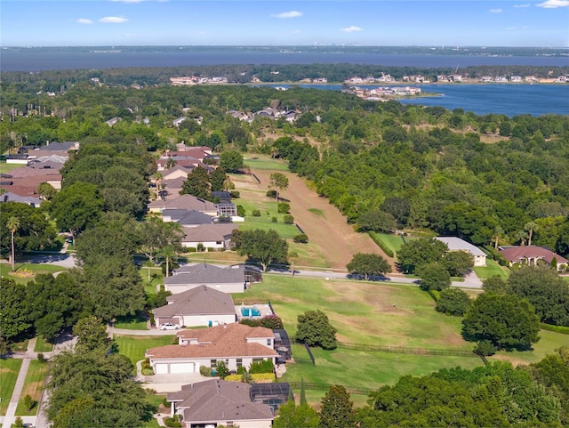 drone / aerial view with a water view and a residential view