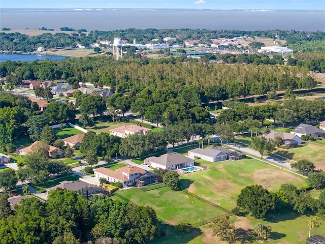 bird's eye view featuring a water view and a residential view